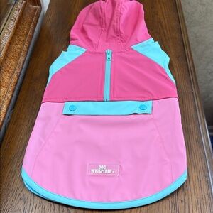 Dog Whisperer Dog hooded rain jacket. Size Small. Pink and aqua. Snap pocket.